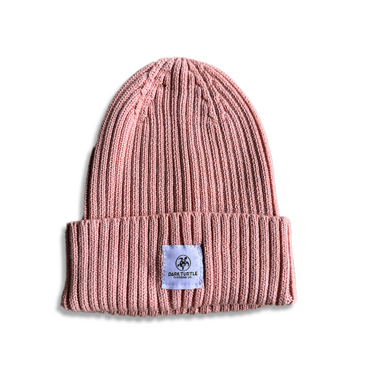 Pink beanie with a label on a white background