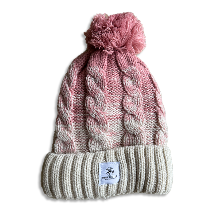 Knitted beanie with pom-pom on a white background